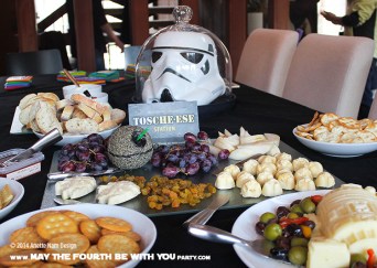 Star Wars Food: Tosche-ese Station with Cheese, Crackers, Grapes, and Raisin (molded cheese from silicone mold) /// Check out our blog for lots of Star Wars Party food recipes and downloadable labels! Great for a Birthday Party or a May the Fourth be with you Party. /// #starwars #starwarsparty #maythefourthbewithyou #starwarsbirthday #starwarsfood #cheese #toschestation maythefourthbewithyoupartyblog.com