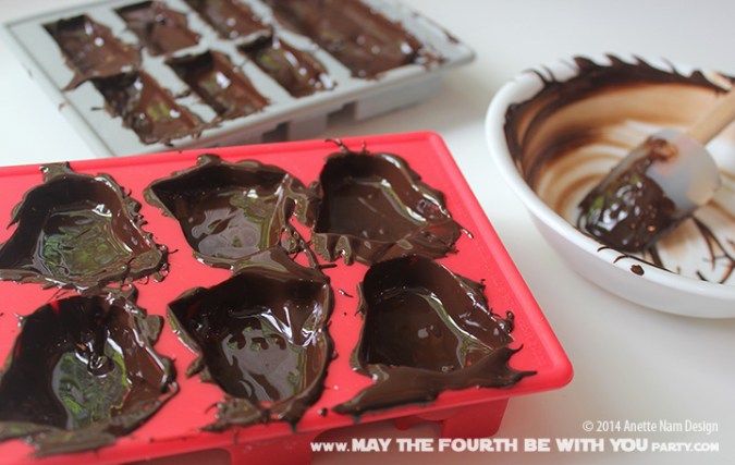Star Wars Food: Han Solo in Carbonite Chocolate with Soy butter and Darth Vader Chocolates with Caramel (from silicone mold) /// Check out our blog for lots of Star Wars Party food recipes and downloadable labels! Great for a Birthday Party or a May the Fourth be with you Party. /// #starwars #starwarsparty #maythefourthbewithyou #starwarsbirthday #starwarsfood #hansolo #chocolate #darthvader maythefourthbewithyoupartyblog.com