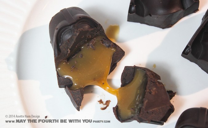 Star Wars Food: Darth Vader Chocolates with Caramel (from silicone mold) /// Check out our blog for lots of Star Wars Party food recipes and downloadable labels! Great for a Birthday Party or a May the Fourth be with you Party. /// #starwars #starwarsparty #maythefourthbewithyou #starwarsbirthday #starwarsfood #darthvader #chocolate maythefourthbewithyoupartyblog.com