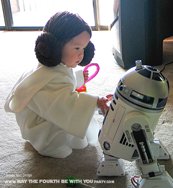 DIY Princess Leia Costume. Check out all our other Star Wars costumes on our blog! #princessleia #starwars #starwarsparty #maythefourthbewithyou #starwarsbirthday #starwarscostume #halloweencostume #leia #r2d2 #cosplay maythefourthbewithyoupartyblog.com