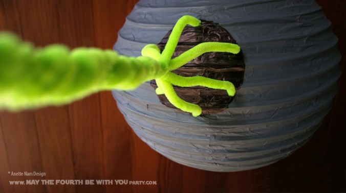 Paper Lantern Death Star // Check out our blog for lots more Star Wars crafts and decor. // #starwars #starwarsparty #maythefourthbewithyou #starwarsbirthday #banners #deathstar #paperlanter maythefourthbewithyoupartyblog.com