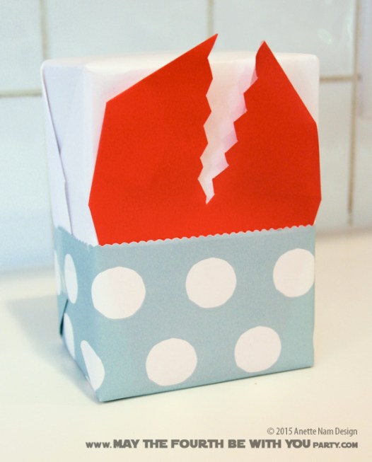 Space Slug Gift Wrapping and Paper Crafts /// Check out our blog for lots of Star Wars Party crafts and ideas /// #starwars #starwarsparty #maythefourthbewithyou #starwarsbirthday #spaceslug #papercraft maythefourthbewithyoupartyblog.com 